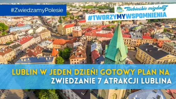 Widok z lotu ptaka na Lublin z kolorowymi kamienicami i zieloną wieżą kościelną.